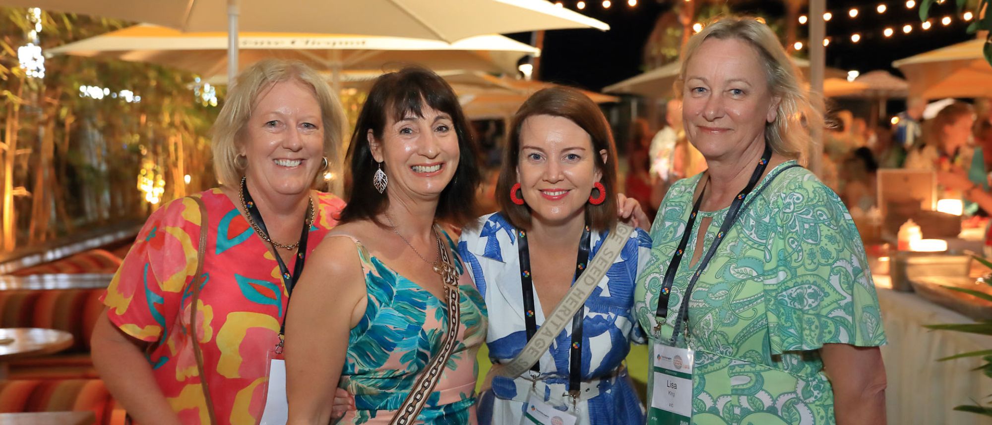 four women at a conference